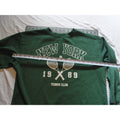 Green crewneck sweatshirt featuring a "New York 1989 Tennis Club" graphic.