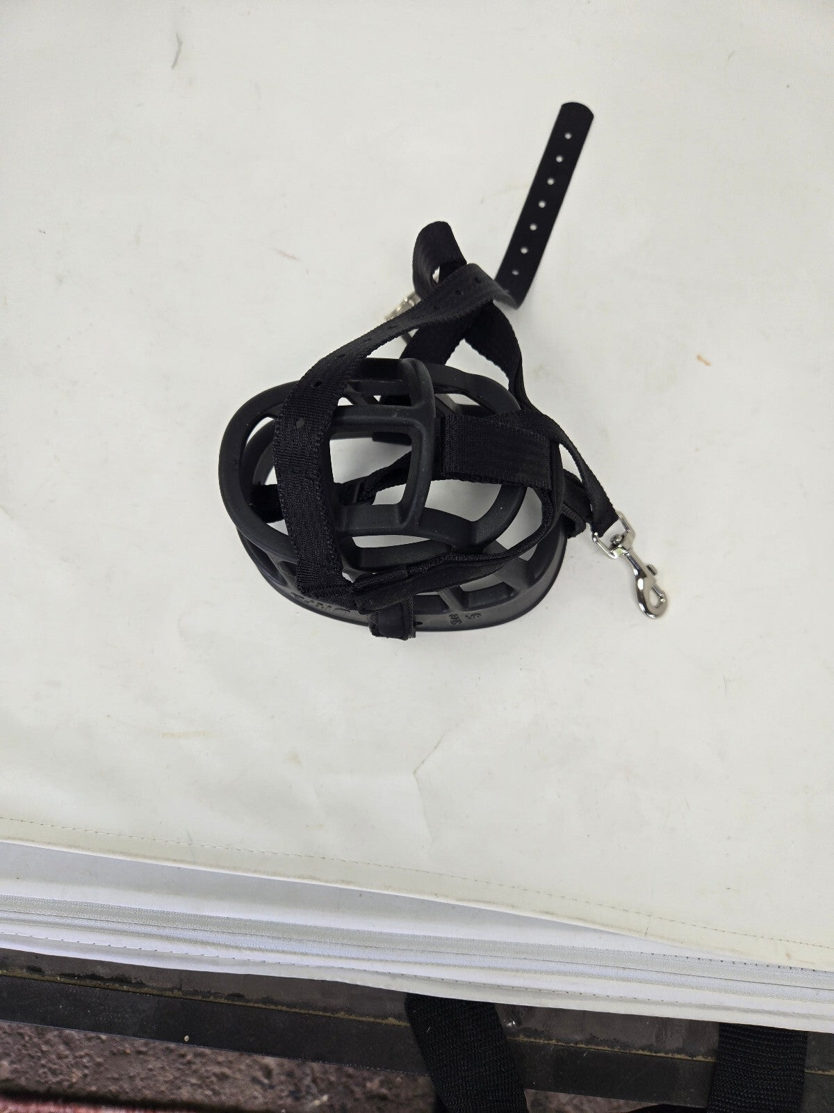 Black dog muzzle with leather strap