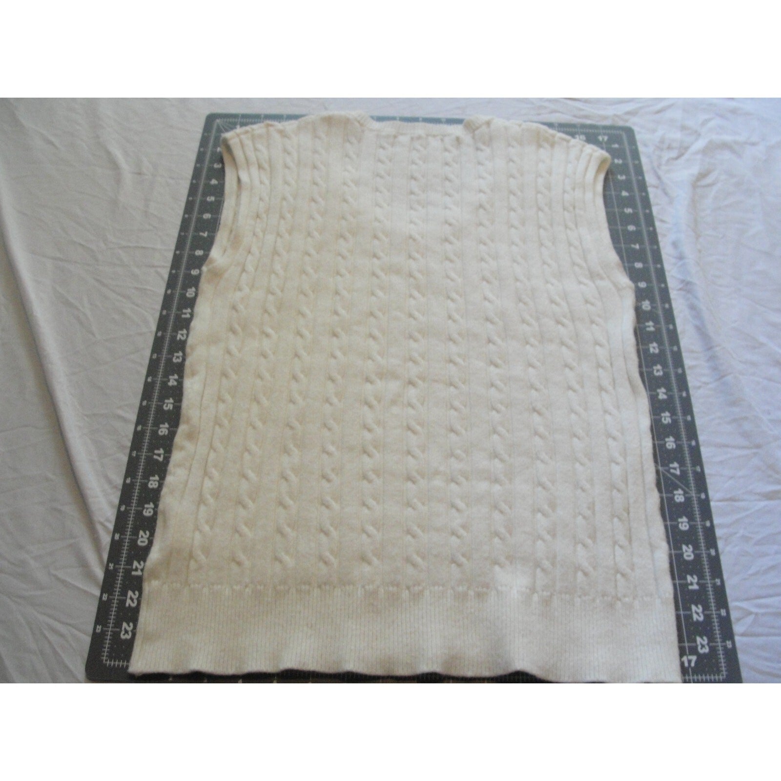 Cream-colored  cable knit V-neck sweater vest size medium