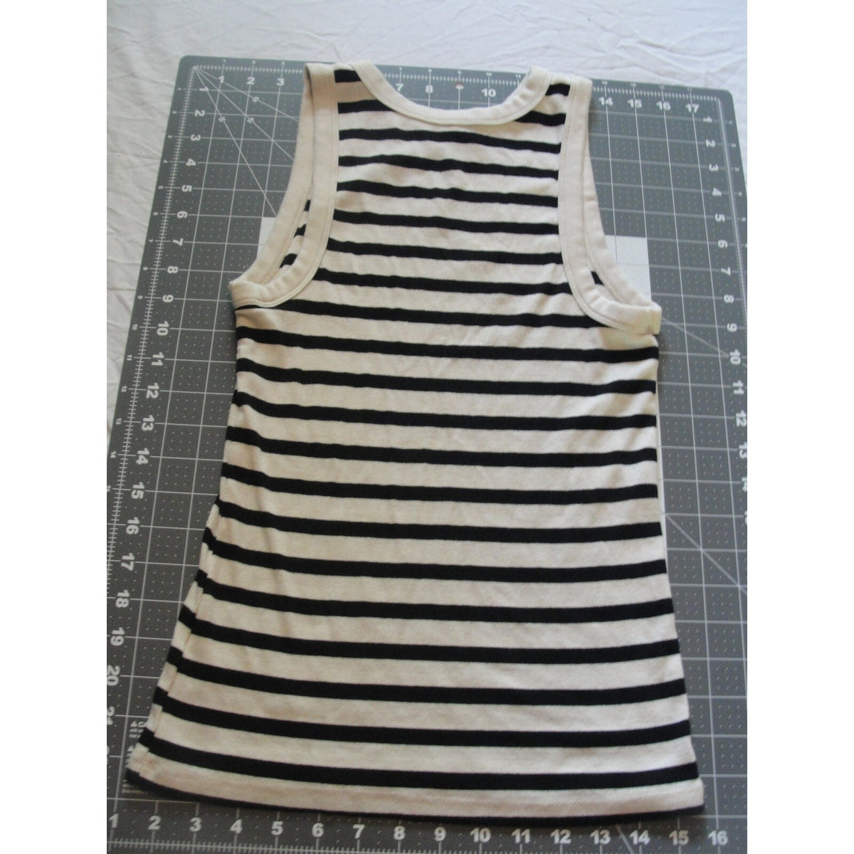 A new day striped tank top featuring a cream-colored trim size medium