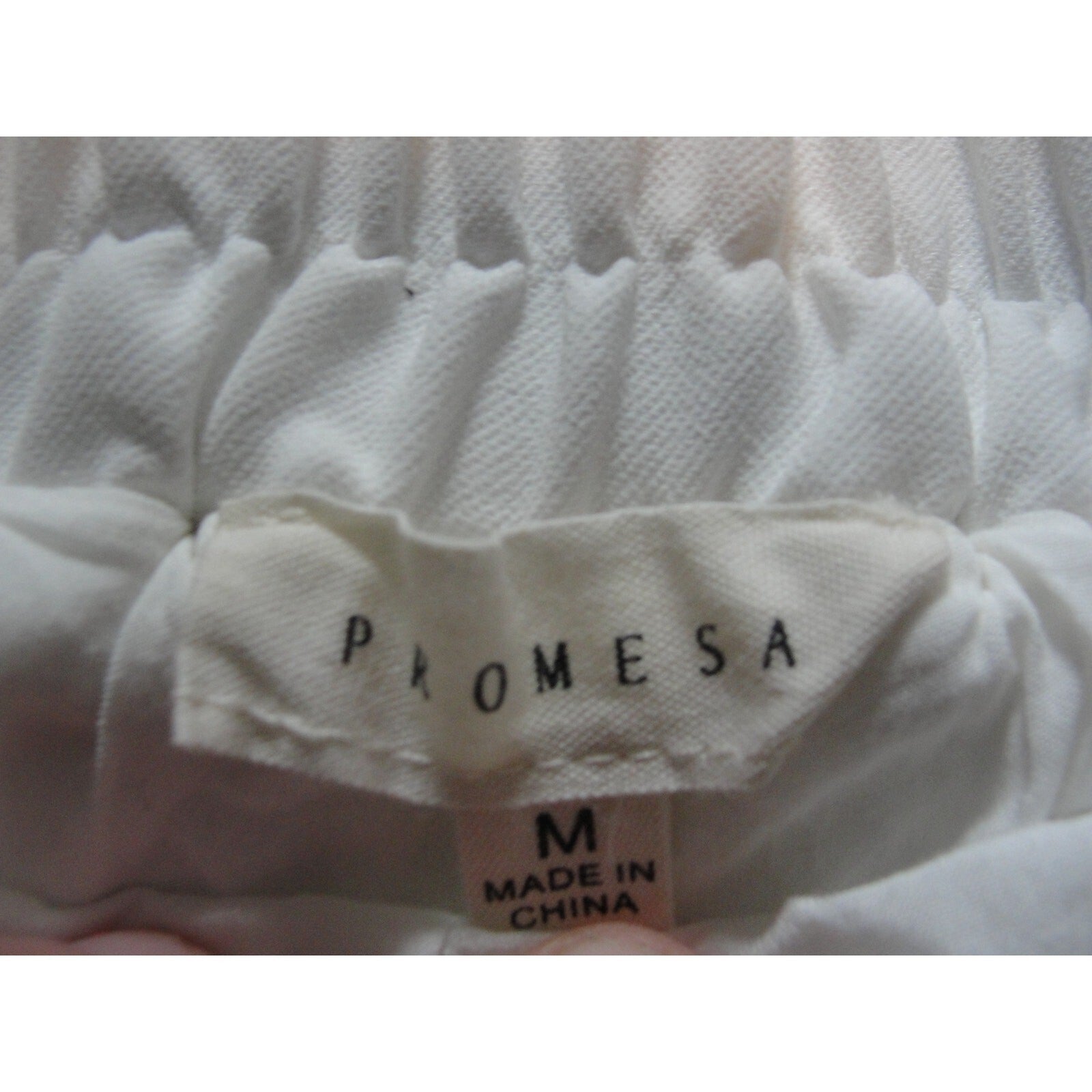 white pleated bubble skort from the brand Promesawith pleated details size med