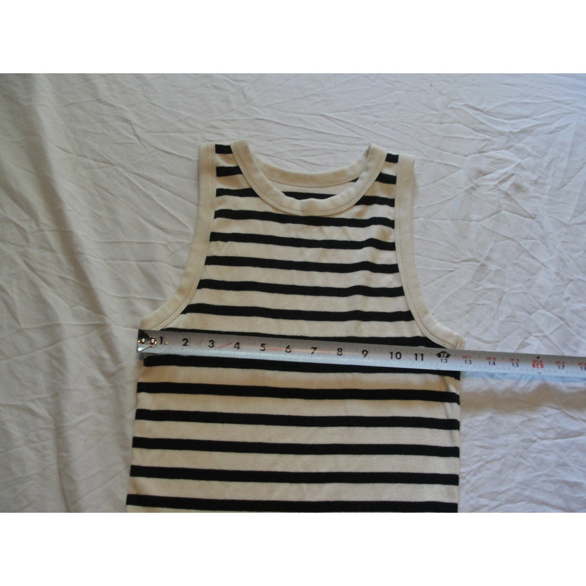 A new day striped tank top featuring a cream-colored trim size medium