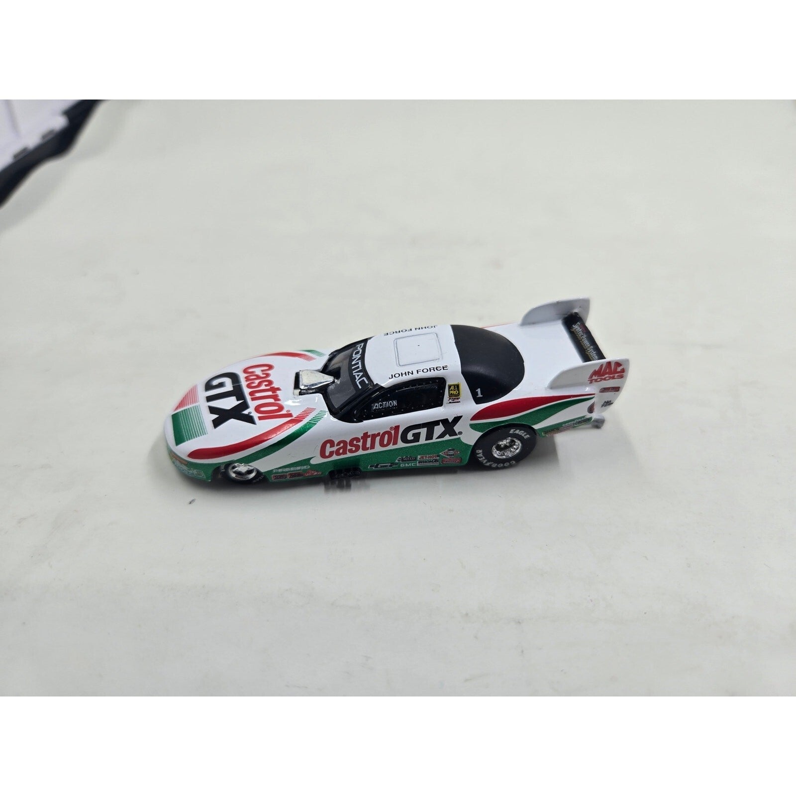 John Force 1997 Castrol GTX Pontiac Firebird NHRA Funny Car 1:64 Scale Action