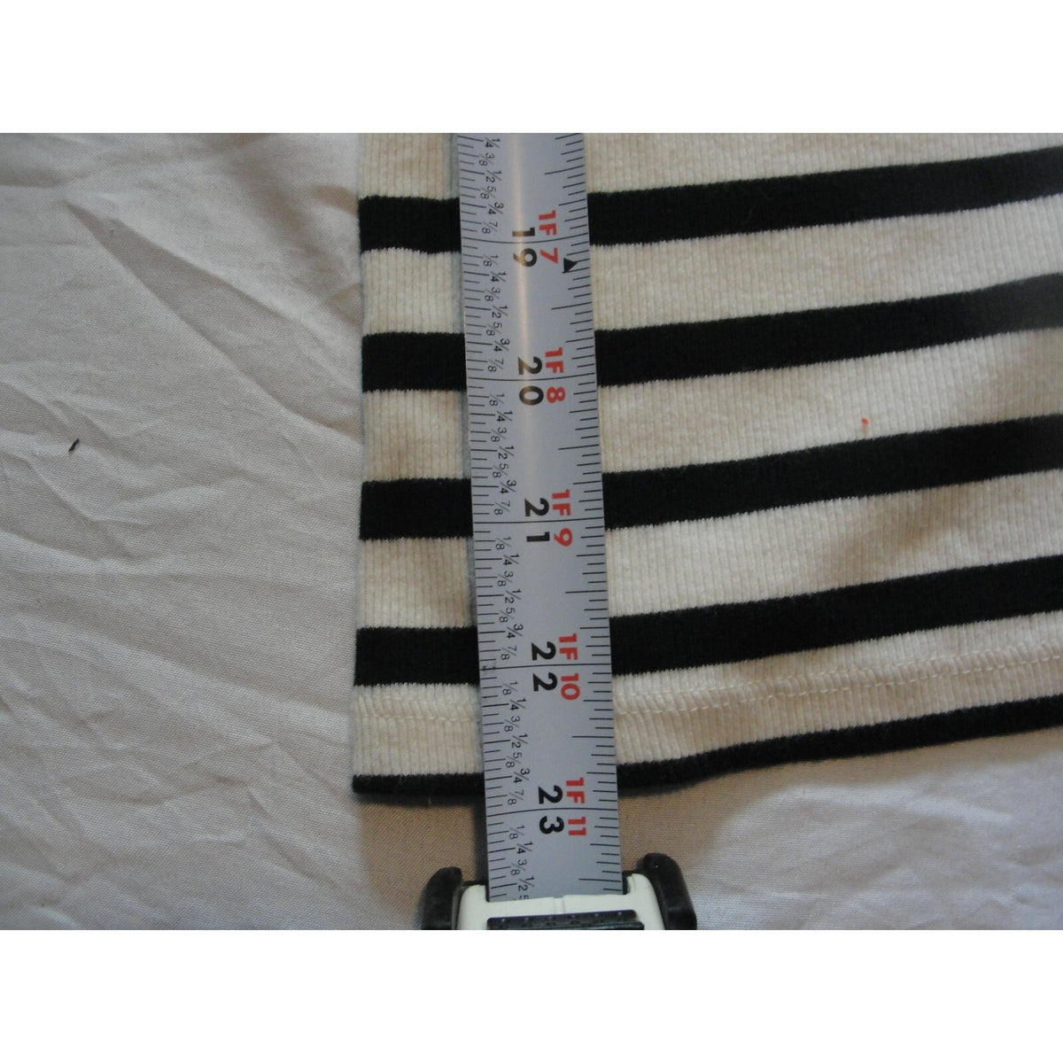 A new day striped tank top featuring a cream-colored trim size medium