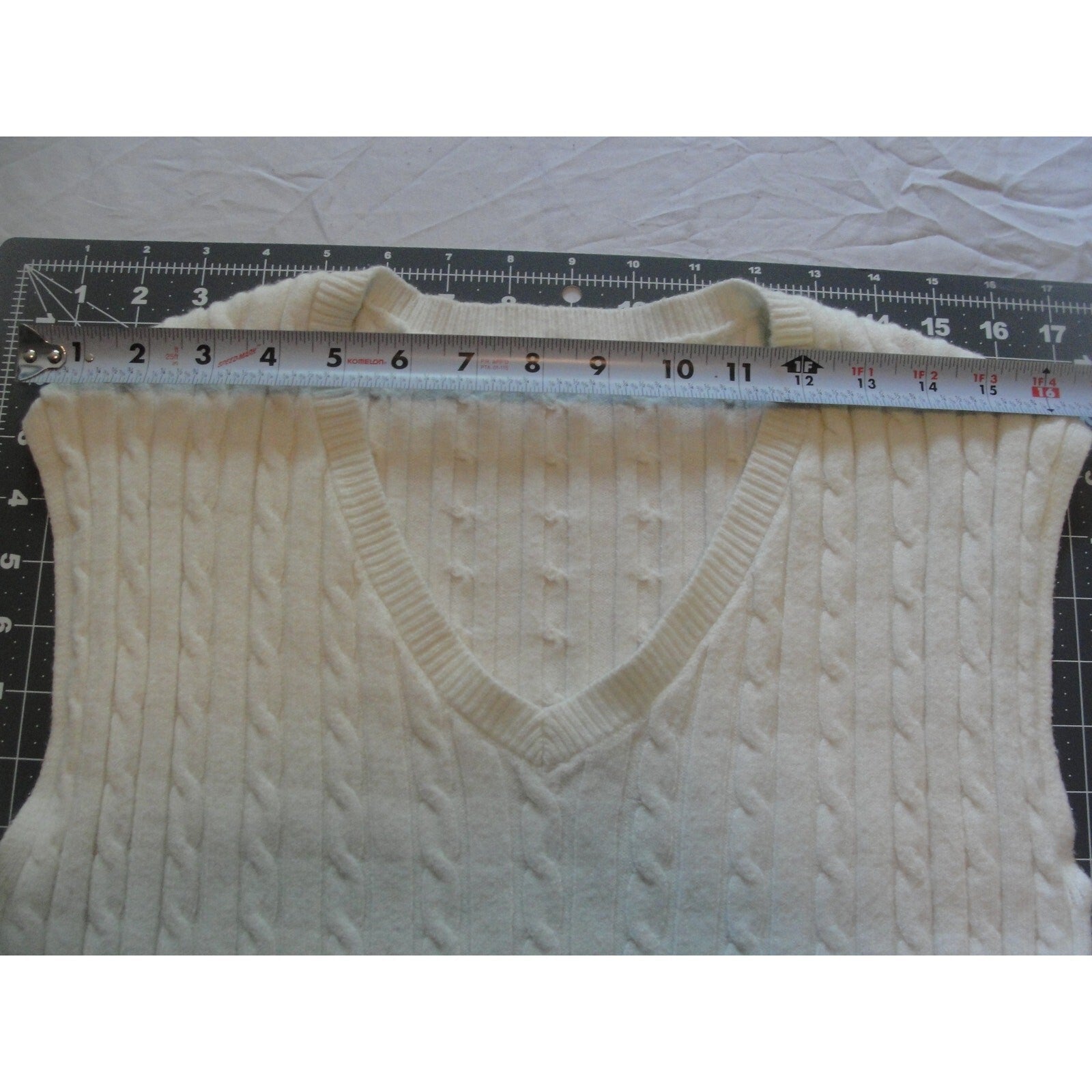 Cream-colored  cable knit V-neck sweater vest size medium