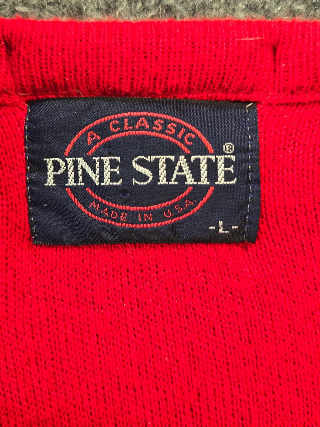 Pine State Red V-Neck Sweater with Chest Emblem