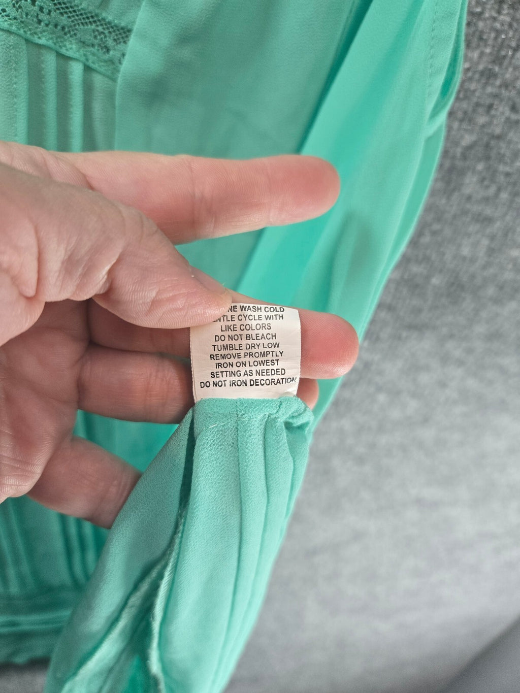 Lightweight Sheer Mint Green Sleeveless Blouse with V-Neck and Pleated Detail