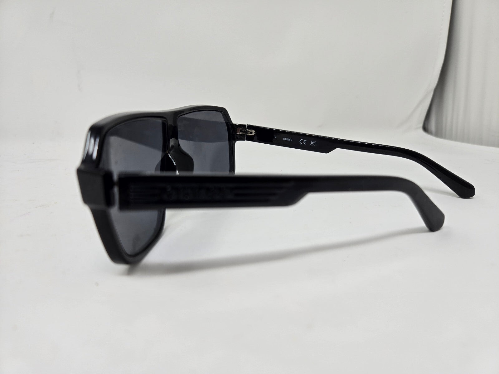 Guess Black Aviator Style Sunglasses with Blue Tinted Lenses