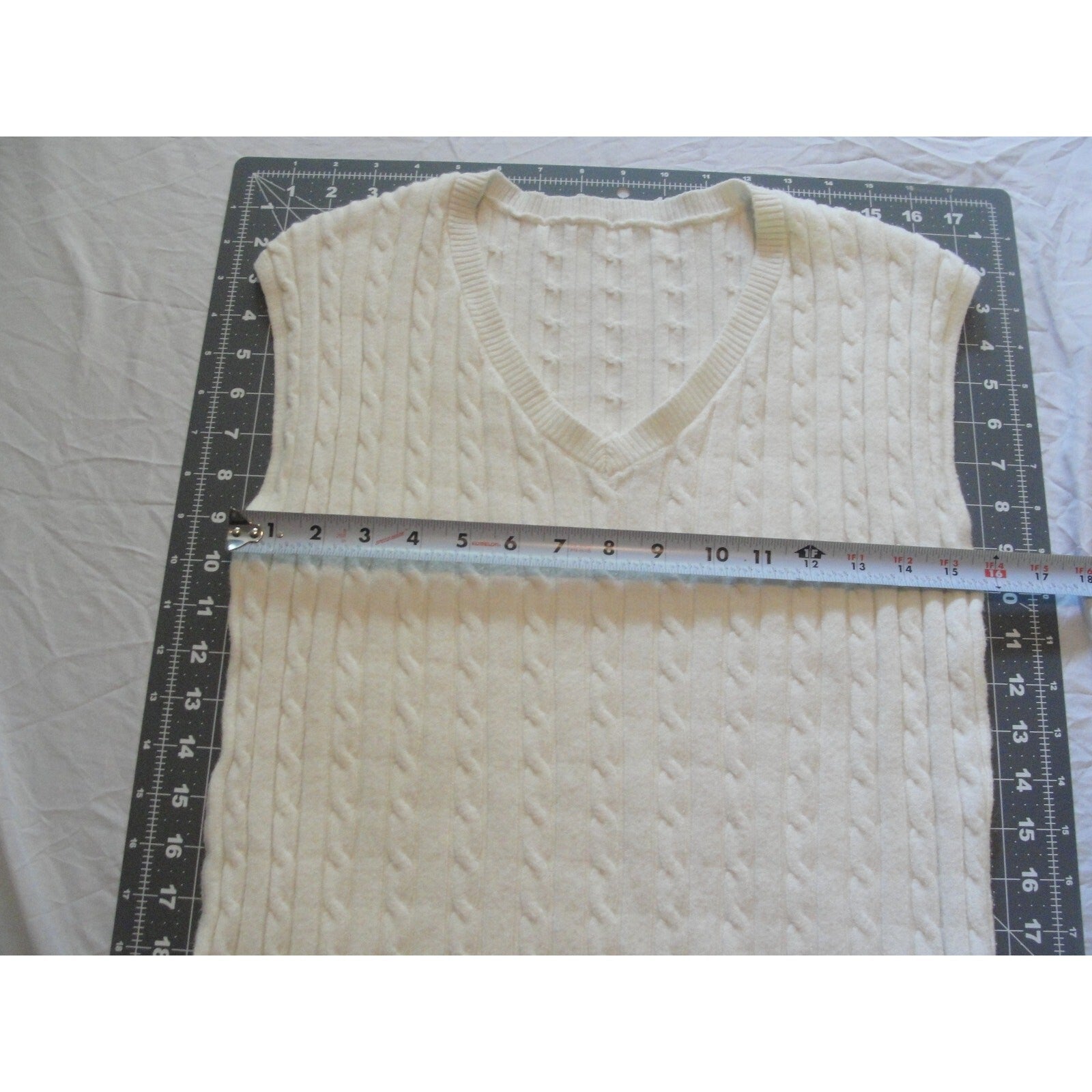 Cream-colored  cable knit V-neck sweater vest size medium