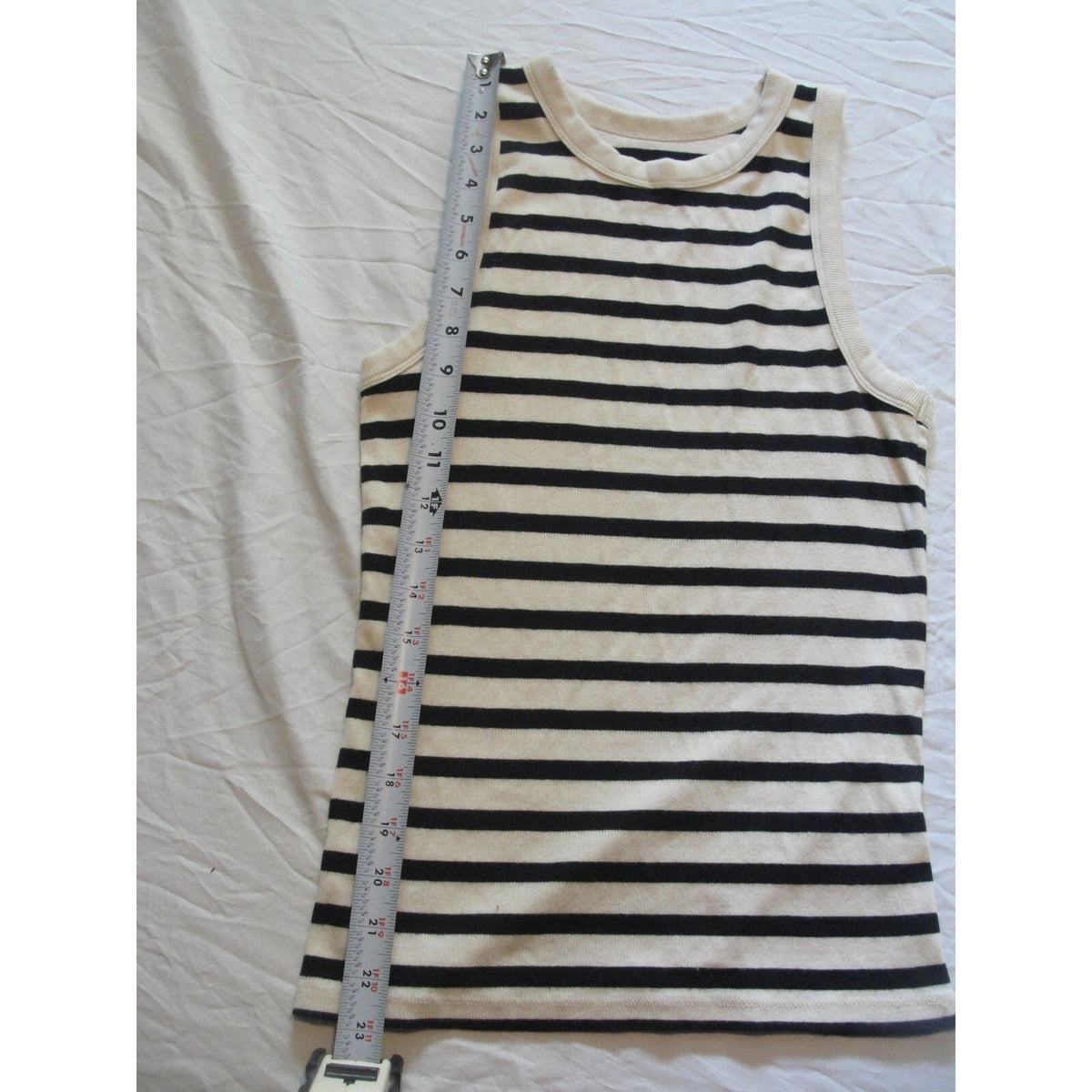 A new day striped tank top featuring a cream-colored trim size medium