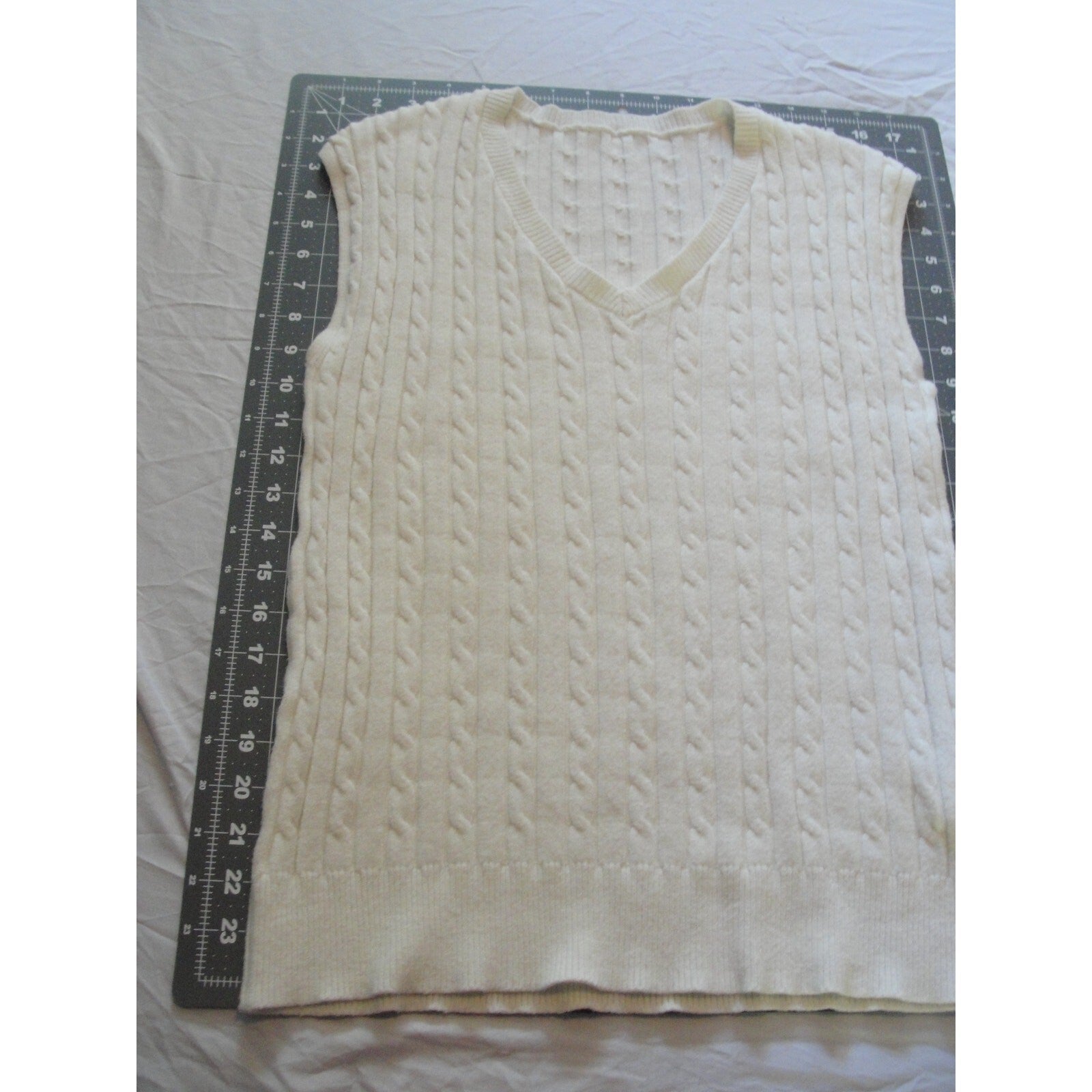 Cream-colored  cable knit V-neck sweater vest size medium
